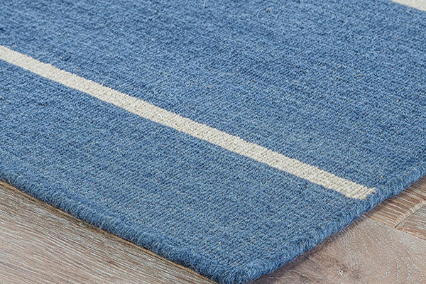 Blue rug with white stripe